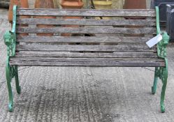 A slatted and cast iron garden bench