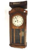 An early 20th century mahogany cased drop dial wall clock.