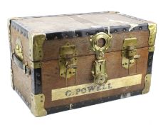 A small wooden travelling trunk.