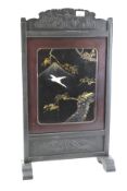 A Japanese lacquered fire screen with white crane and Mount Fuji.
