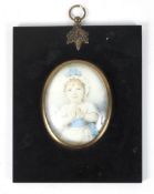 A 19th century minature portrait on ivory of a child in a white dress with blue sash