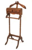 A 20th century gentlemans dressing stand with two short drawers and trouser rail and a