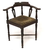 An early 20th century mahogany corner chair.