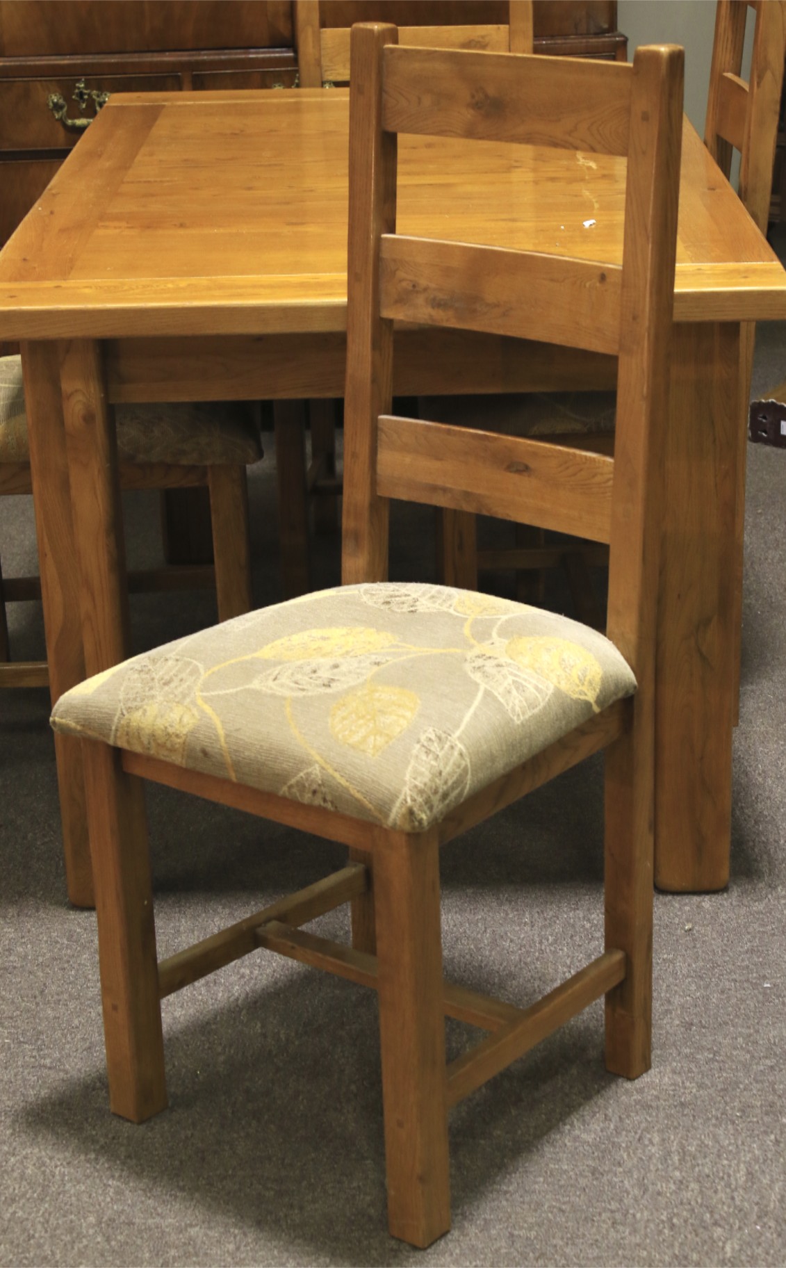 A contemporary dining table and four upholstered chairs. - Image 3 of 3