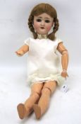 An early 20th century composite and bisque articulated doll.