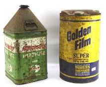 Two vintage tractor oil cans.