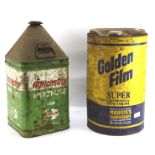 Two vintage tractor oil cans.
