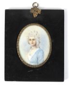 A 19th century minature portrait on ivory depicting a lady in a blue dress