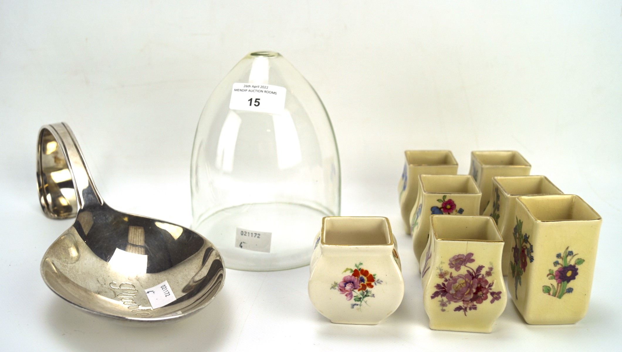 Seven Royal Doulton miniature vases and other items.