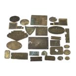 An assortment of metal plaques for engines and motors.