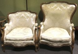 Two French Louis XV style walnut framed armchairs.