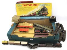 An assortment of model railway related items including Trix train cadet set, locomotives, etc.