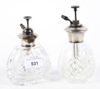 Two silver mounted glass atomisers.