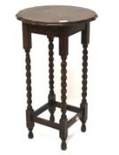 A 20th century oak occasional table.