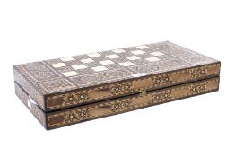 A parquetry inlaid chess and draughts box with bone chess pieces.