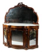 A Victorian mirror backed serpentine mahogany marble topped credenza.