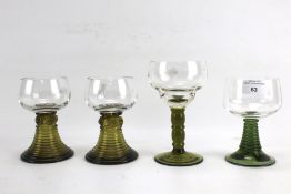 Four German green stemmed hock glasses.