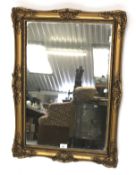 A 20th century gilt framed wall mirror.