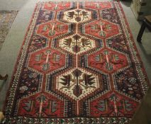 An early 20th century hand knotted floor rug.