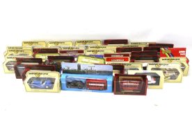 Sixteen straw boxed models of Yesteryear, 16 + 12 boxed models of Yesteryear, including Corgi, etc.