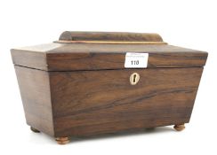 A 19th century rosewood veneered tea caddy of sarcophagus form.