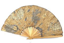 A vintage oversized folding wooden fan.