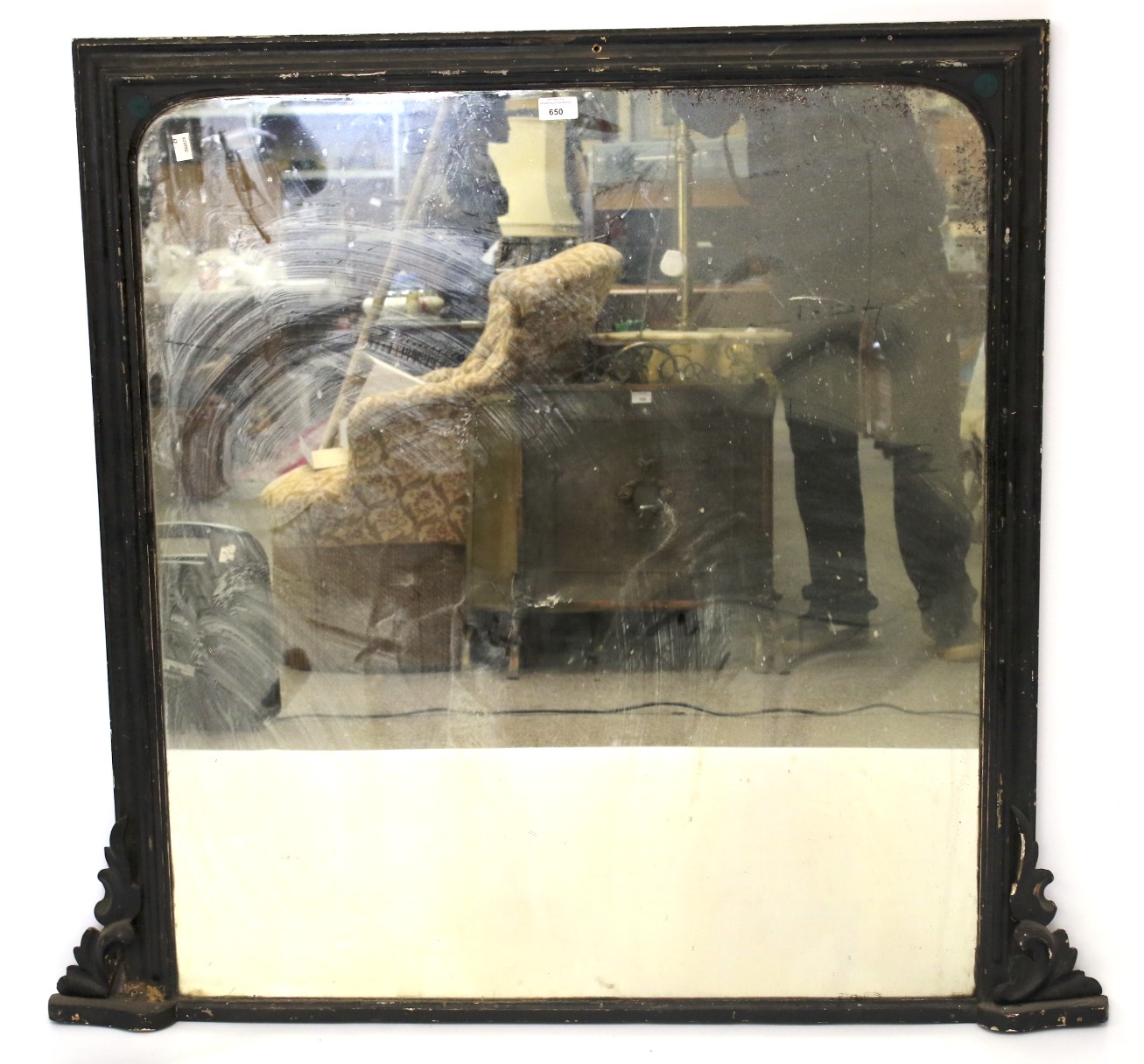 A late 19th century black painted overmantel mirror.
