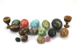 A collection of 20th century stone eggs of varying size and material