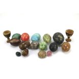 A collection of 20th century stone eggs of varying size and material