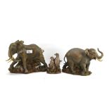 Three contemporary resin animal figures by Ann Richmond of elephants and meerkats.