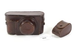 An original Leica III leather fitted ever-ready case together with similar Leitz accessory case