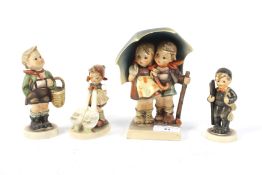 An assortment of four Hummel Goebel figures of children. Largest H15.