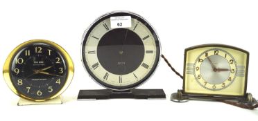 Three vintage mantel alarm clocks.