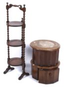 An early 20th century cake stand and a 19th century fluted mahogany chamber pot with foot stand.