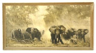 A large print of elephants between trees.