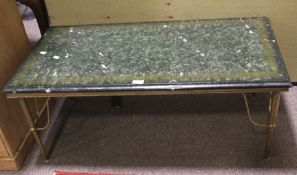 A mid-century faux marble topped coffee table.