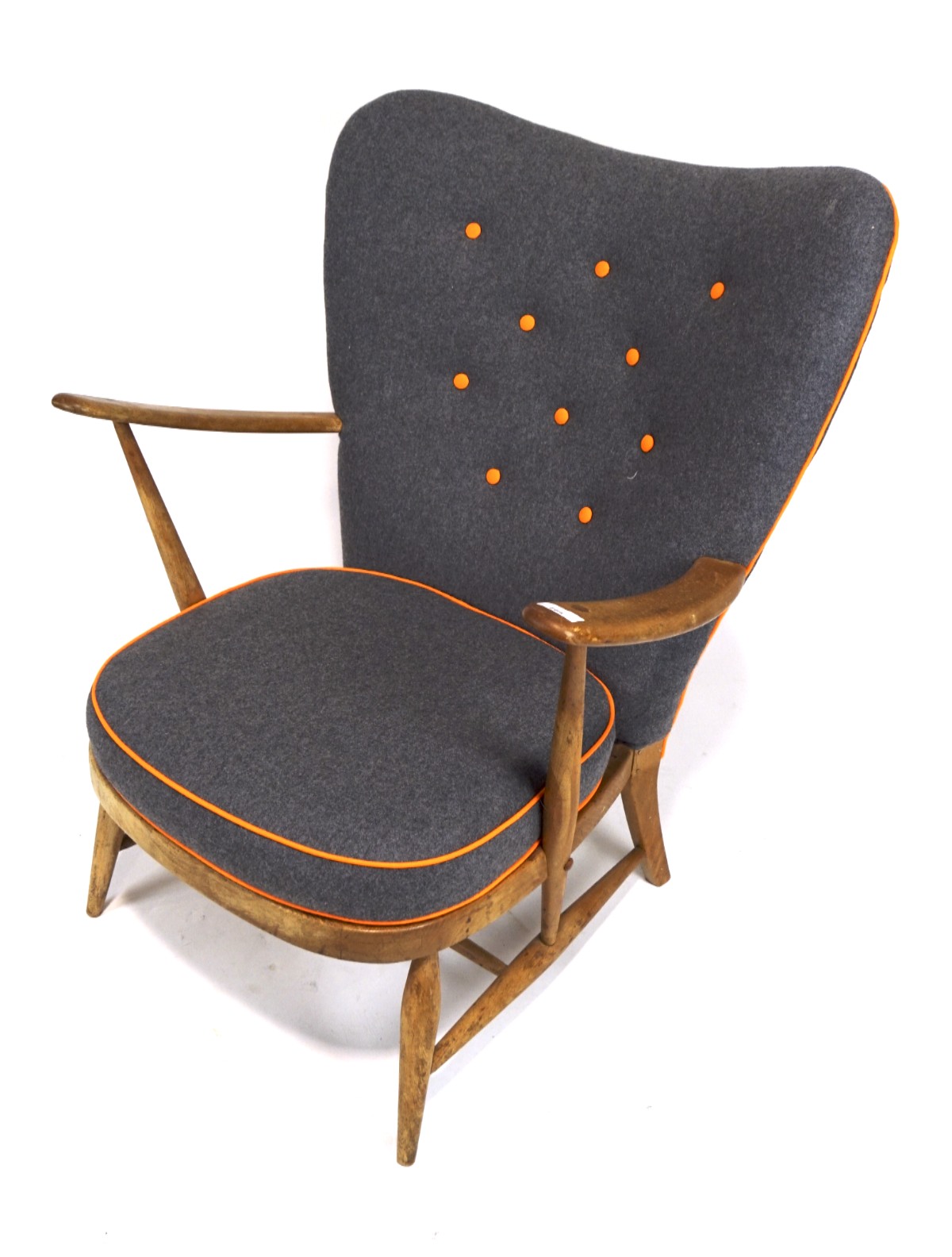 A rare Ercol model 312 1950s vintage wing back lounge chair.