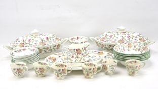A Minton 'Haddon Hall' six setting part dinner service decorated with flowers with green rims.