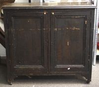 A late 19th/early 20th century painted pine two door cupboard.