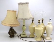 An assortment of six contemporary table lamps.