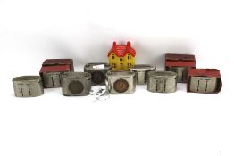 An assortment of vintage building society money banks including pieces by Fiscus Limited