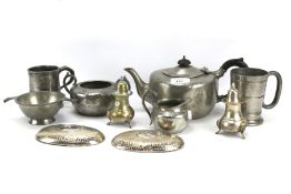 An assortment of pewter and other metal wares.