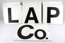 A collection of vintage wall mounting letters.