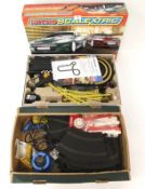 A boxed Micro Scalextric Austin Martin and a 1960s mini set