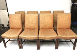 A set of eight dining chairs.
