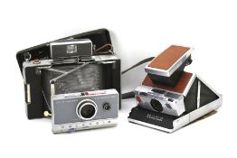 A Polaroid SX-70 Land Camera and a Polaroid Land Camera Automatic 100