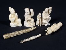 A collection of late 19th/early 20th century carved ivory figures and other items.