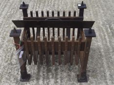 An early 20th century cast iron fire grate.