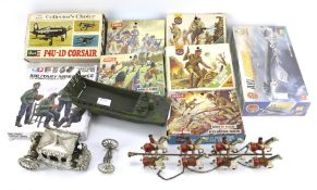 An assortment of vintage airfix kits and soldiers.