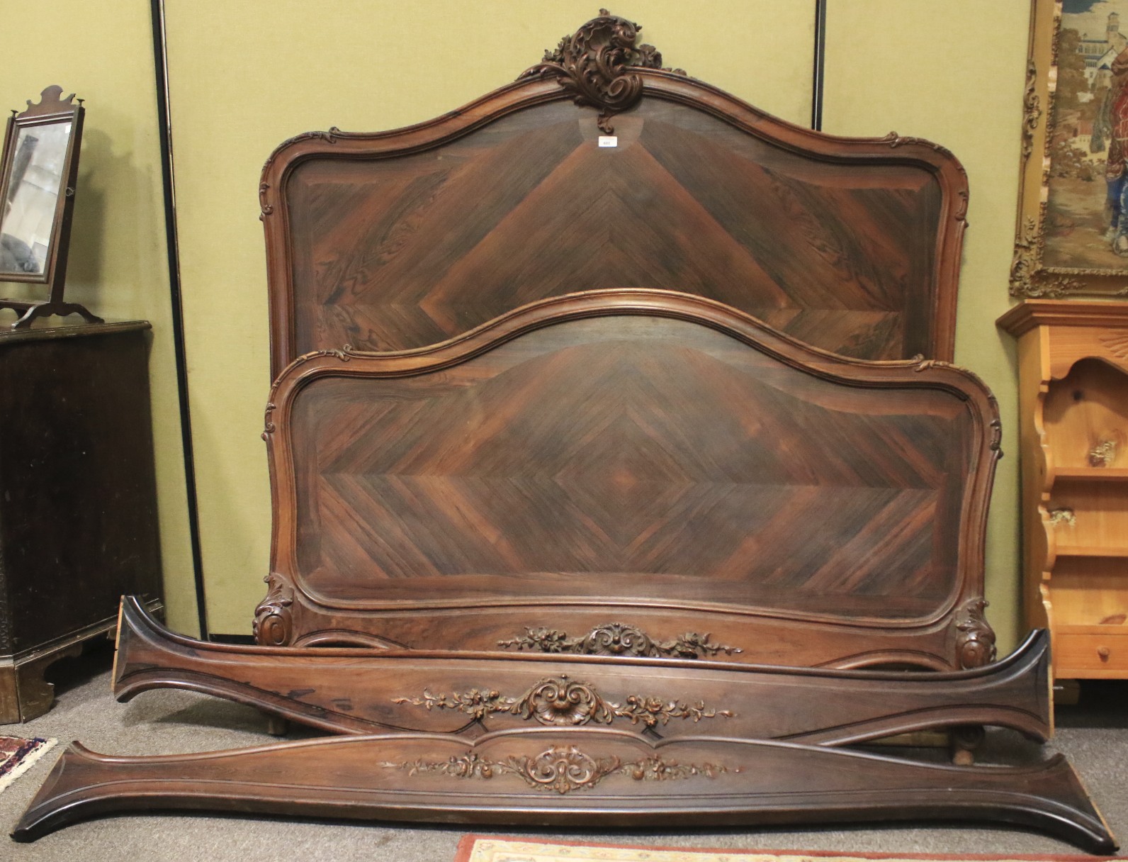 A French Louis XV style wooden veneered double bed.